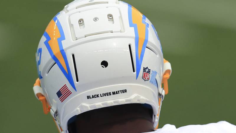 Los Angeles Chargers' Denzel Perryman has a Black Live Matter logo on the back of his helmet...