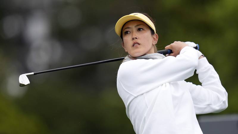 Michelle Wie West hits from the 12th tee during the first round of the U.S. Women's Open golf...