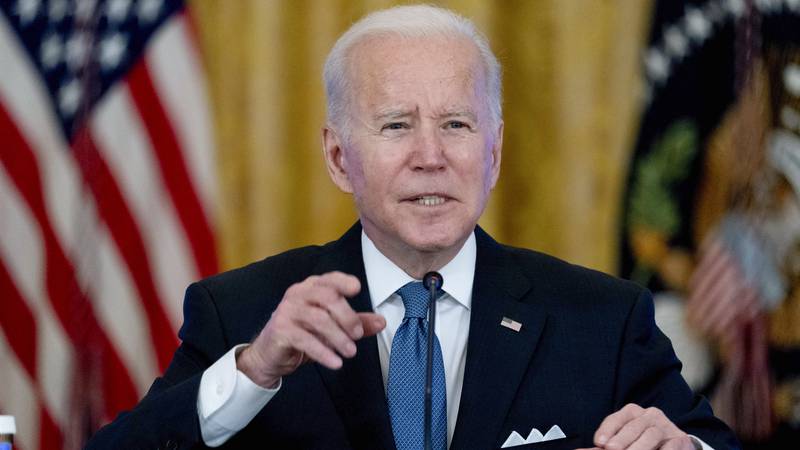 President Joe Biden responds to reporters' questions during a meeting on efforts to lower...
