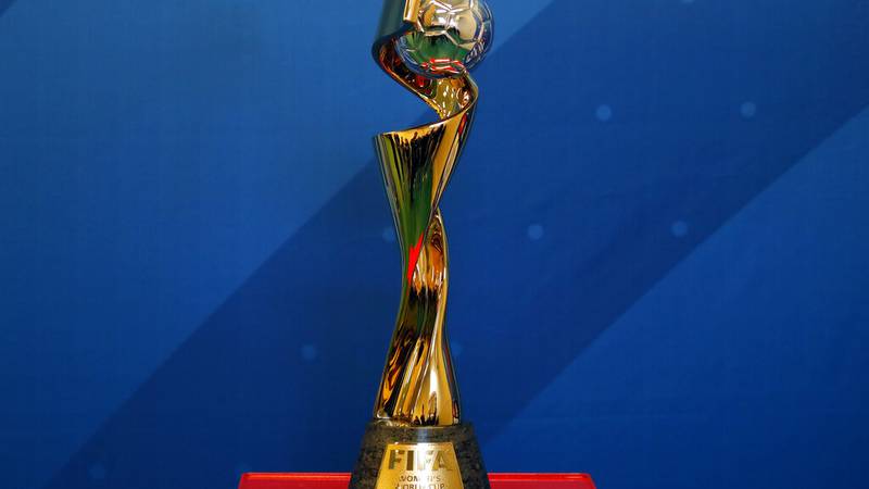The Women's soccer World Cup trophy is on display during its presention in a Paris school,...